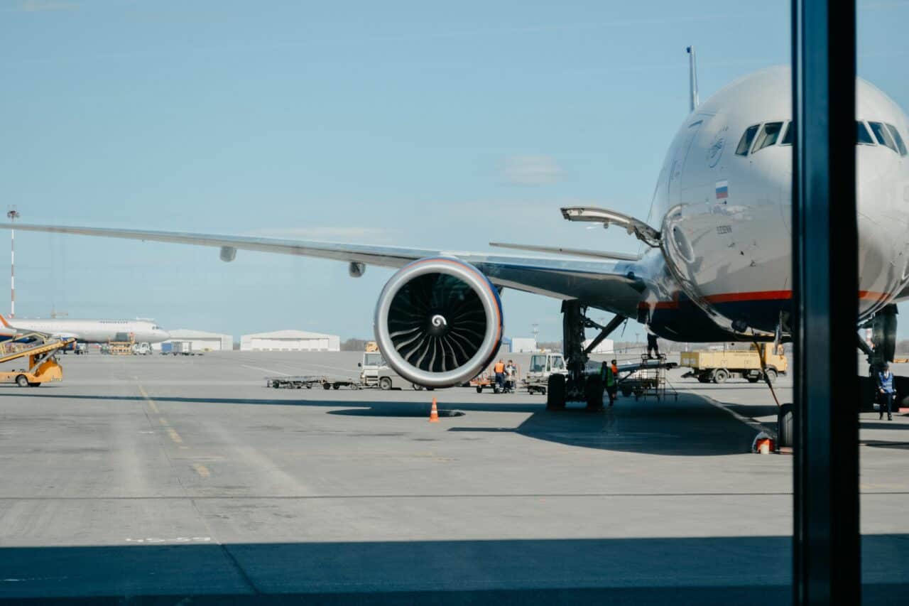 A large passenger jet sitting on top of a tarmac