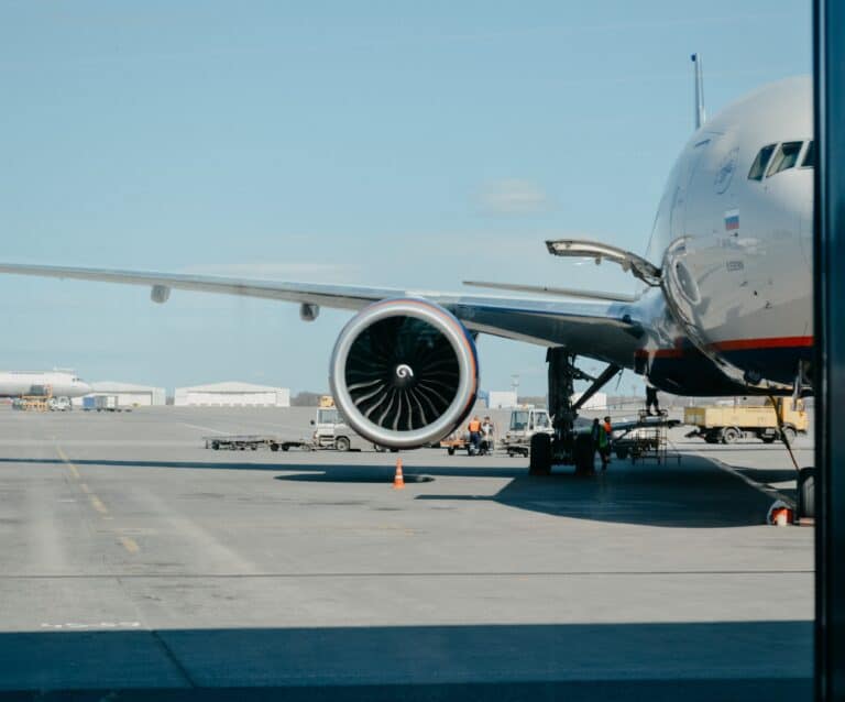 A large passenger jet sitting on top of a tarmac