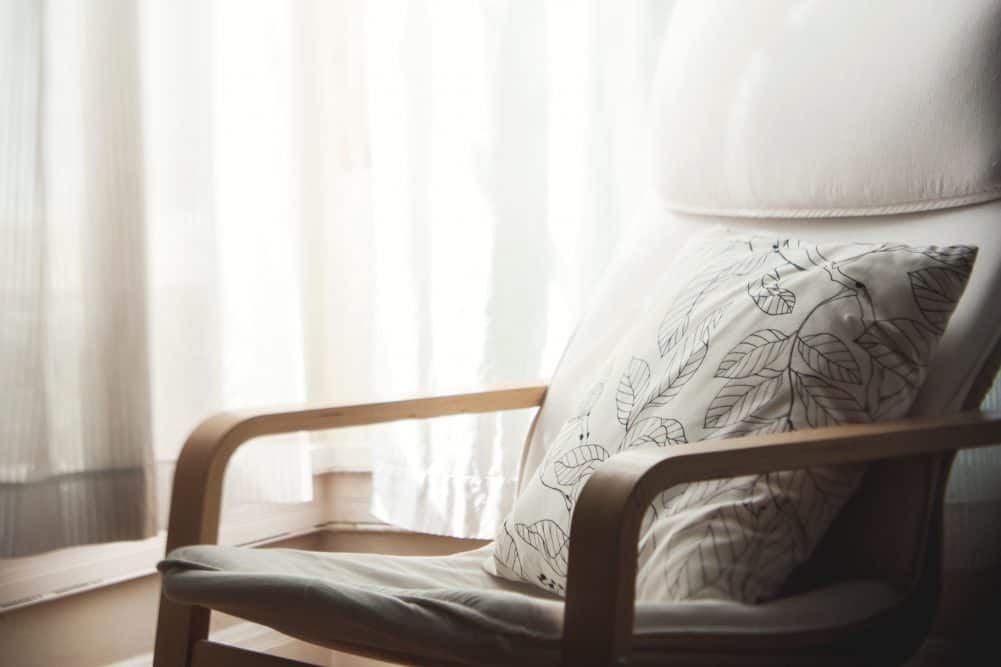 A large bed sitting in a chair