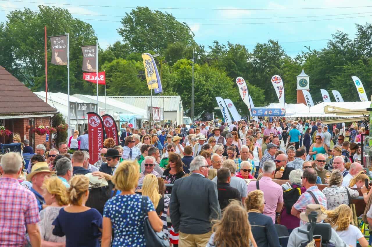 A group of people standing in front of a crowd