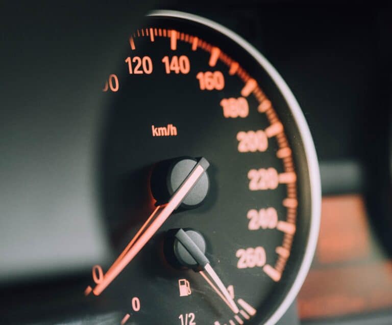 Car dashboard with black and red dials