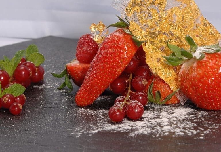 A cake with fruit on top of a table