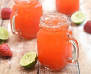 A glass of orange juice, with Lime and Limeade