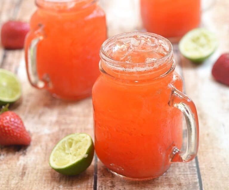 A glass of orange juice, with Lime and Limeade