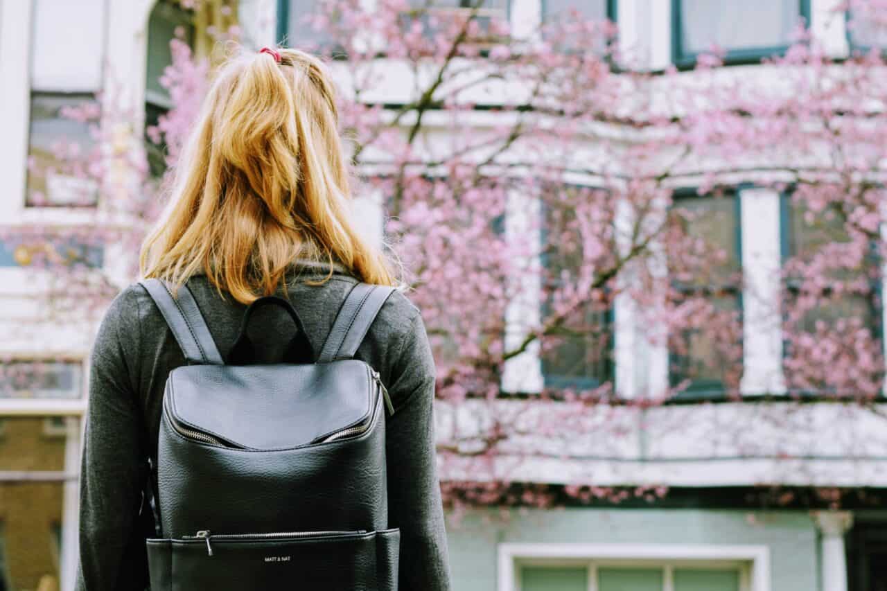 A woman standing in front of a building