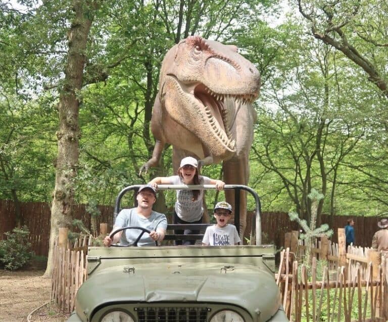 A group of people riding on the back of a truck