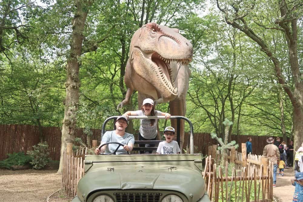 A group of people riding on the back of a truck