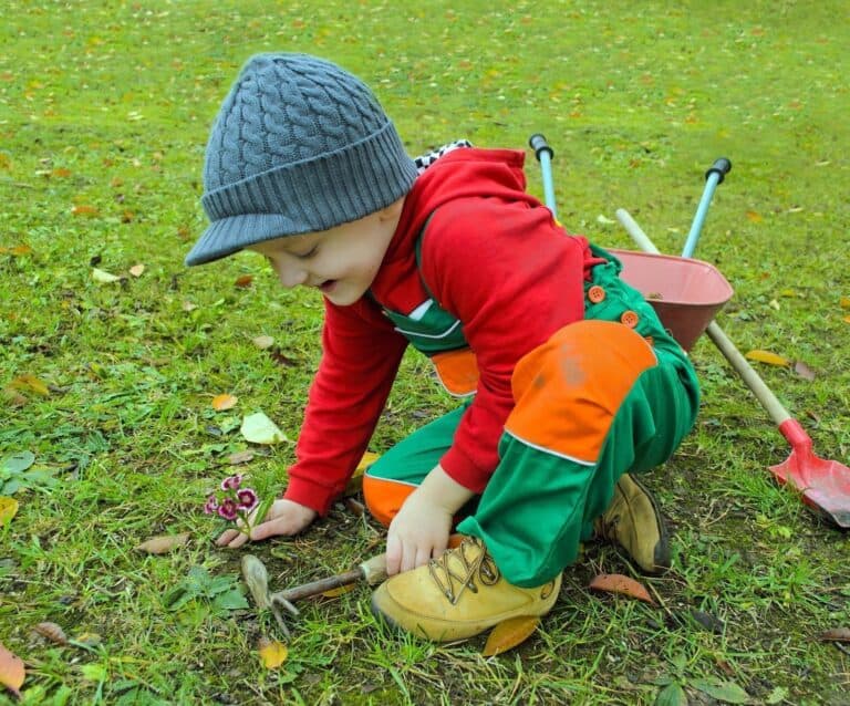 A little boy holding a baseball bat