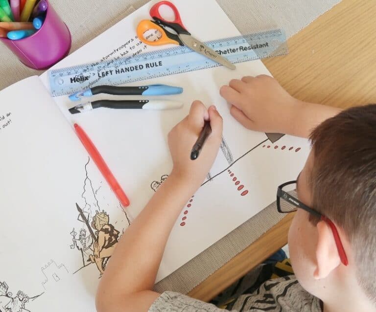 A close up of a person cutting a piece of paper