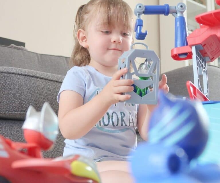 A small child sitting on a table