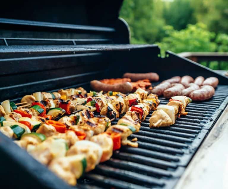 A pizza sitting on top of sushi on a grill