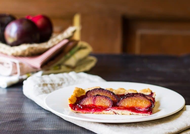 A plate of food on a table, with Pie and Plum