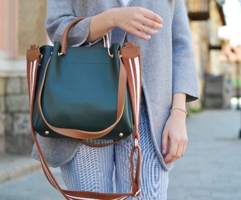 A person holding a piece of luggage