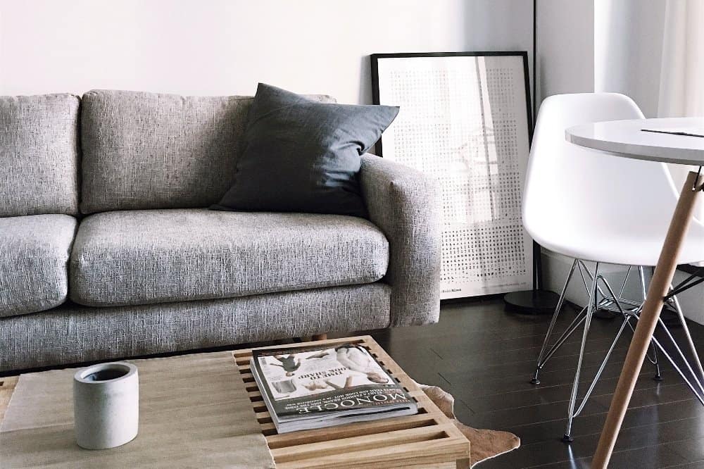 A brown leather couch in a living room