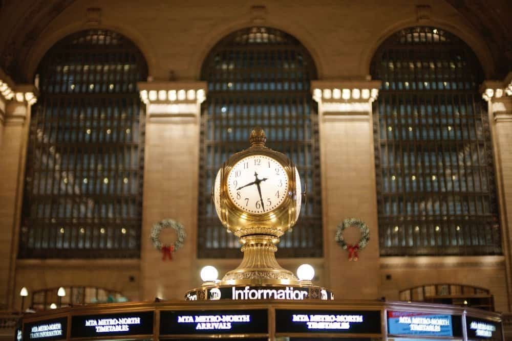 A large clock mounted to the side of a building