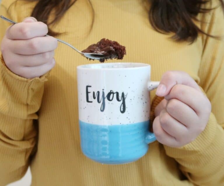 A woman drinking from a cup