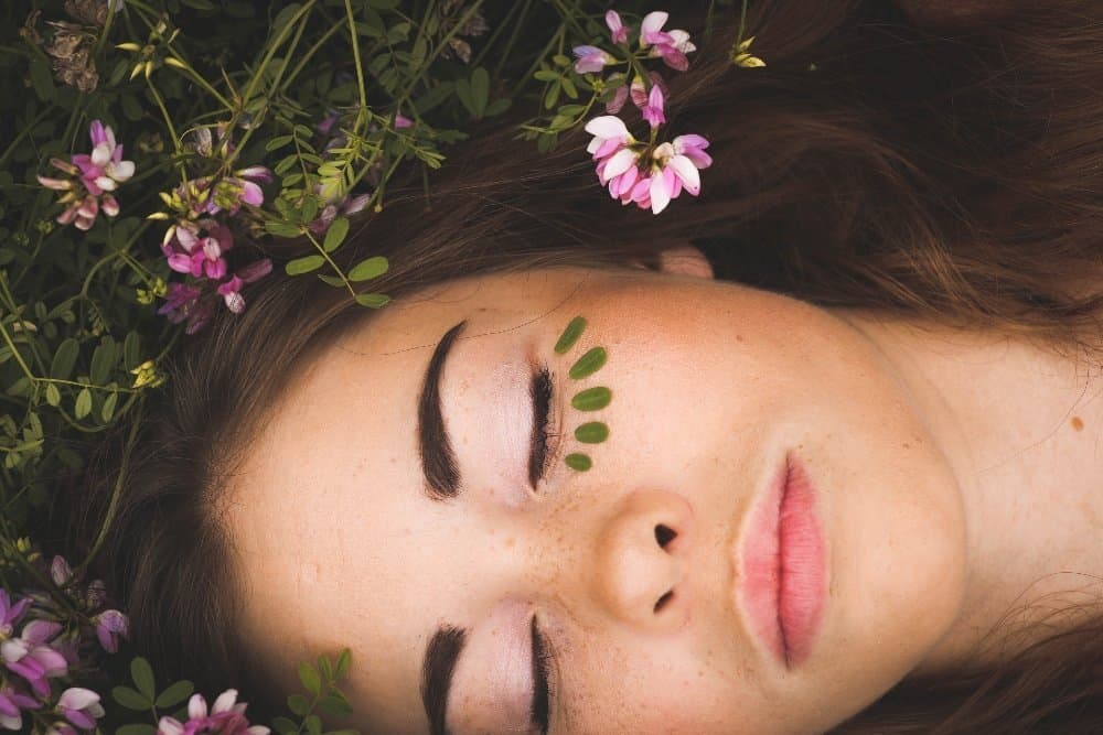 A close up of a person holding a flower