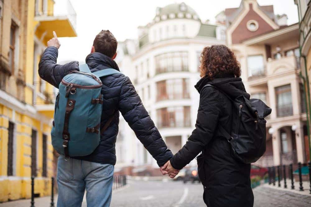 A man and a woman walking down a street