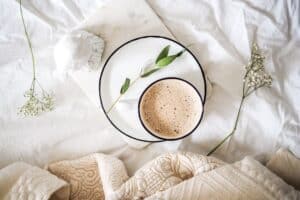 A piece of cake sitting on top of a bed