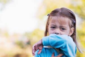 A little girl in a blue shirt