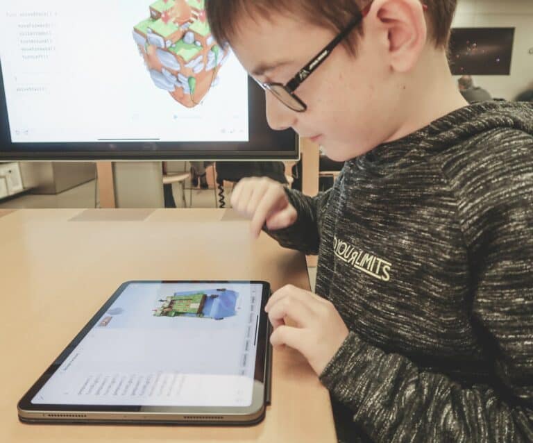 A person standing in front of a computer