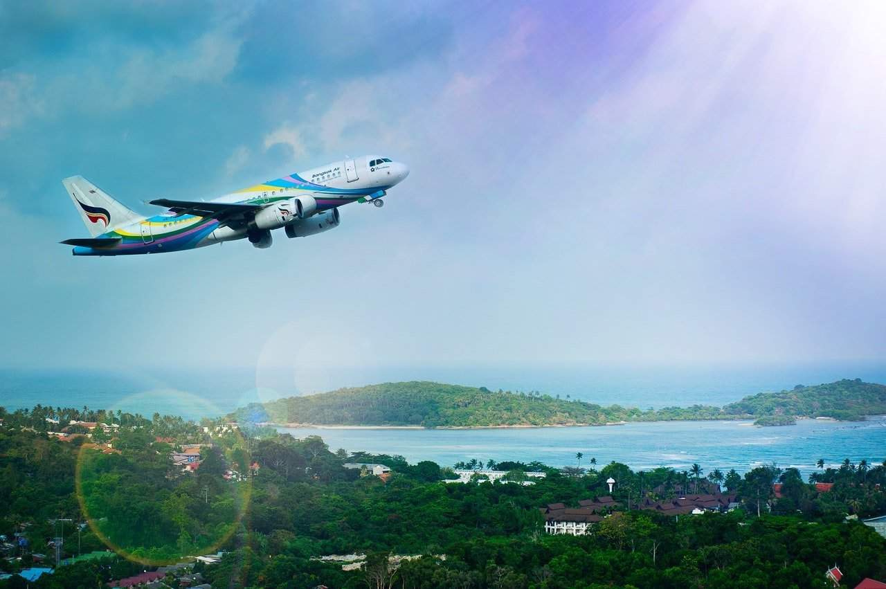 A plane flying over a large body of water