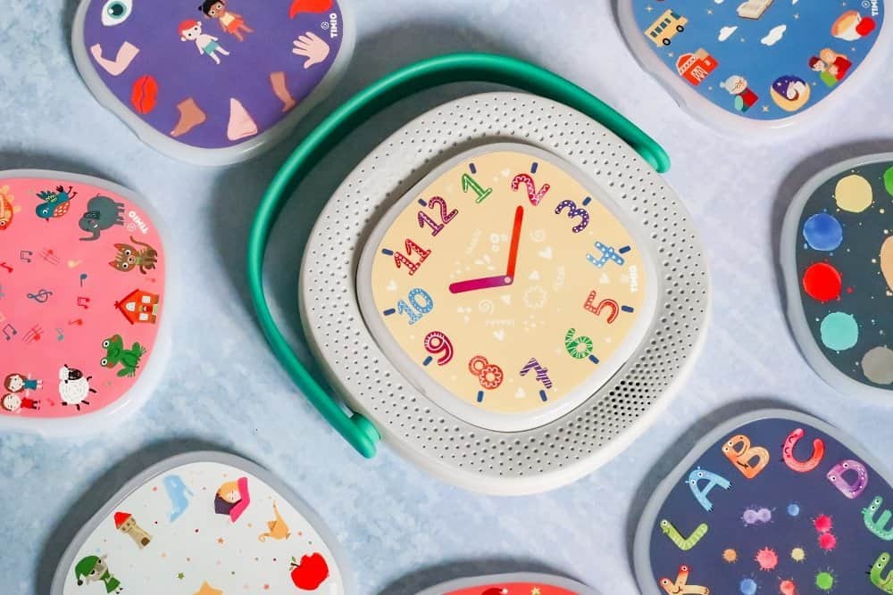 A group of plastic clock on a table