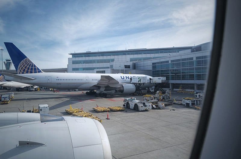 A large passenger jet sitting on top of a tarmac at an airport