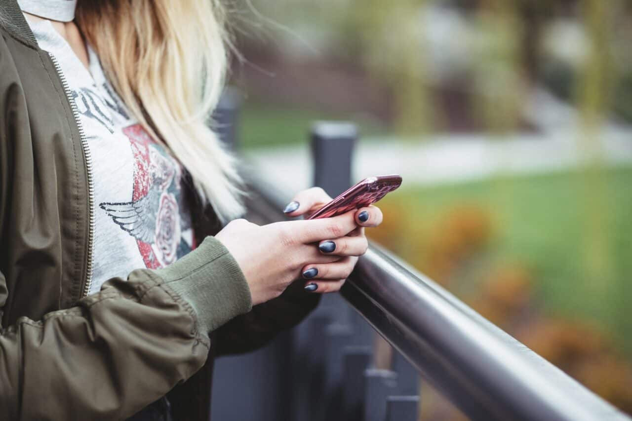 A close up of a person talking on a cell phone