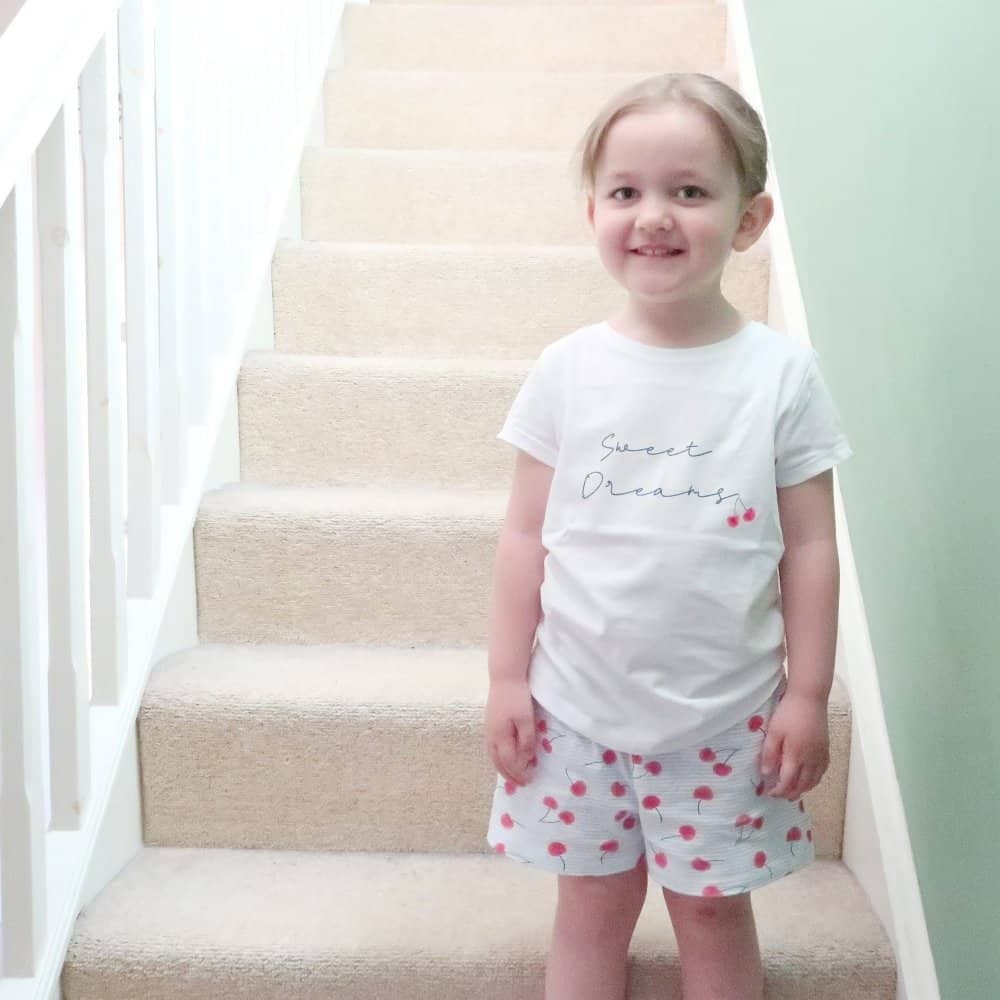 A little girl posing for a picture