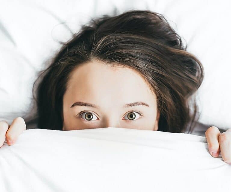 Life In Lockdown - A woman lying on a bed