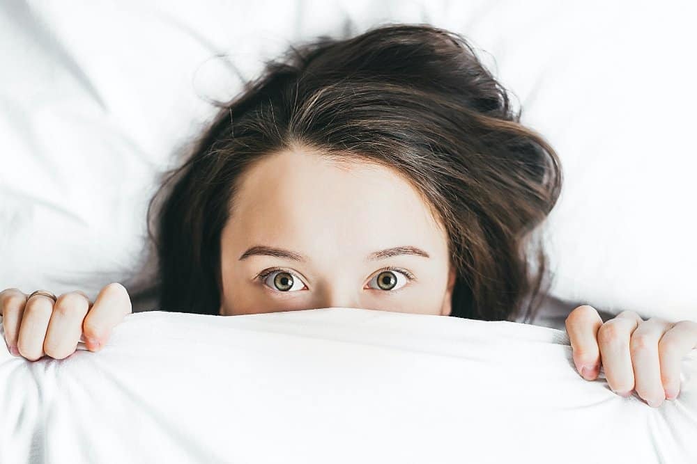 Life In Lockdown - A woman lying on a bed