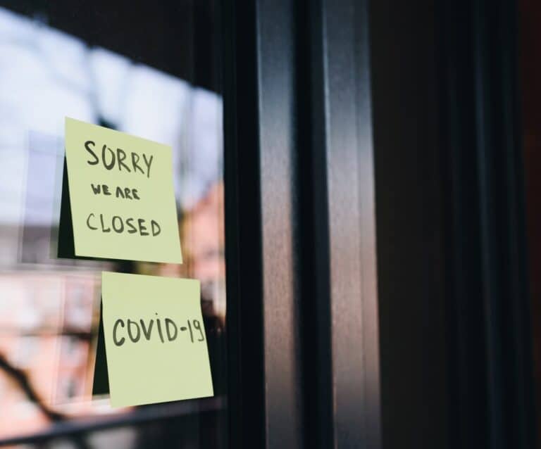 A close up of a sign saying sorry we are closed