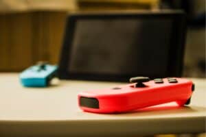 A close up of a remote control sitting on a table