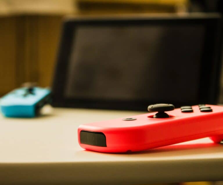 A close up of a remote control sitting on a table