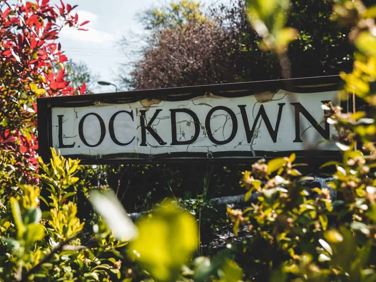 lockdown street sign with foliage