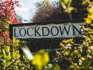 lockdown street sign with foliage