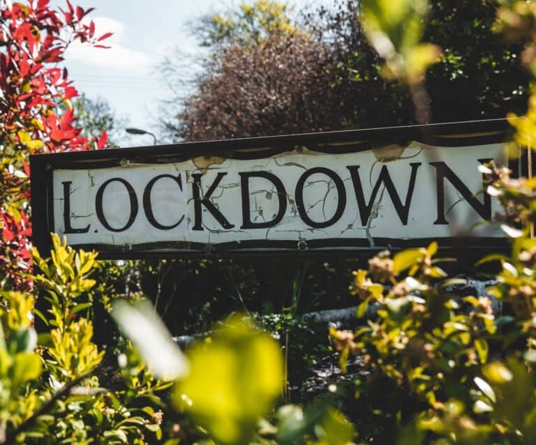 lockdown street sign with foliage