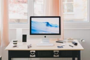 A desktop computer monitor sitting on top of a desk