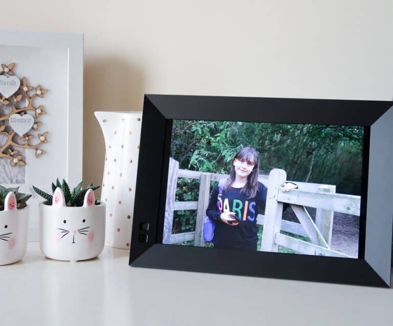 A digital photo frame is sitting on a table