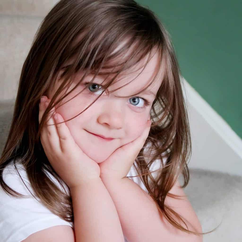 A child sitting on the stairs