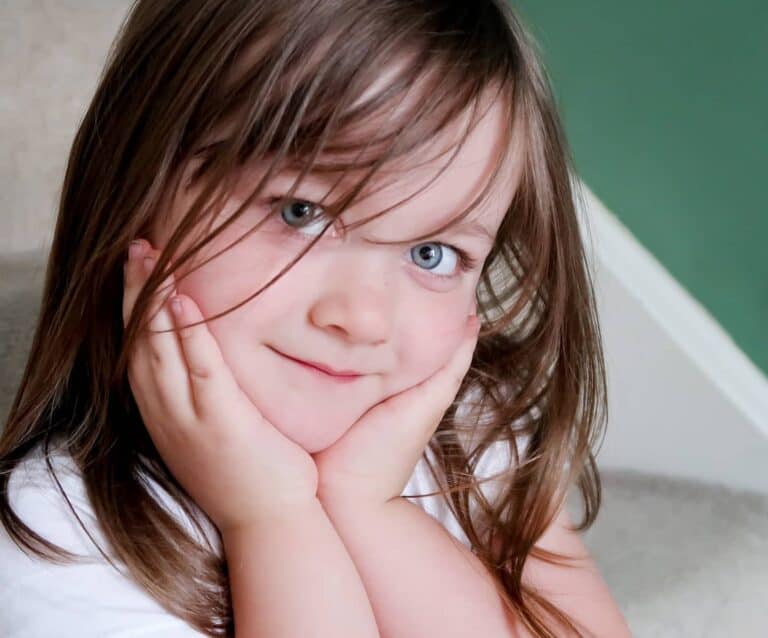 A child sitting on the stairs