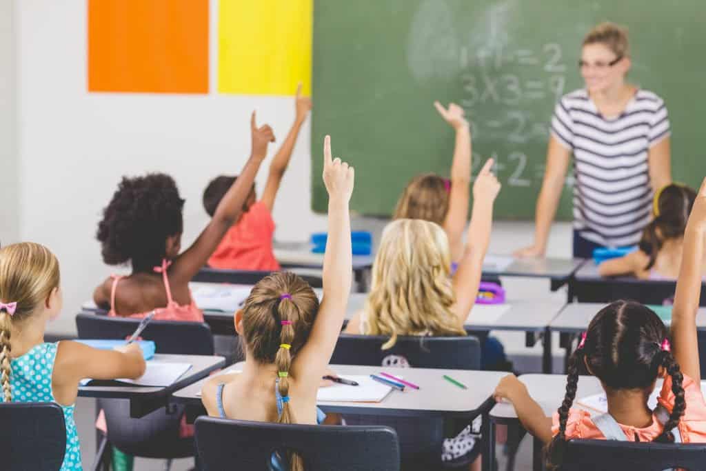 A group of children sitting at school desks