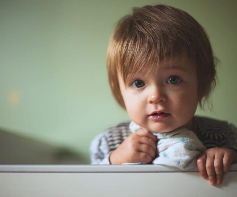 A baby sitting on a table