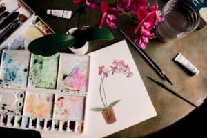 white pink and green floral artwork with art palette