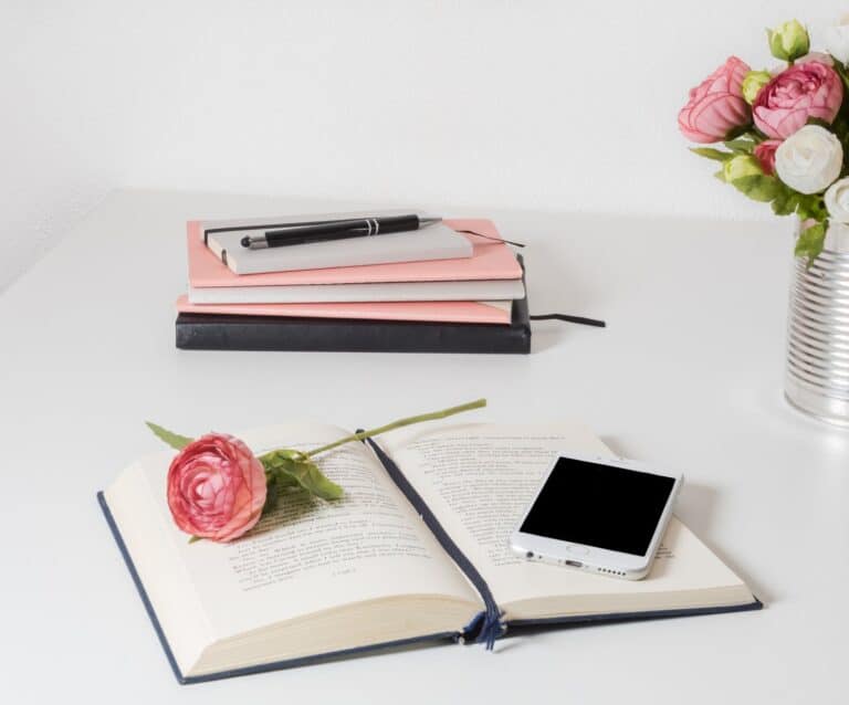 book on a white wooden table