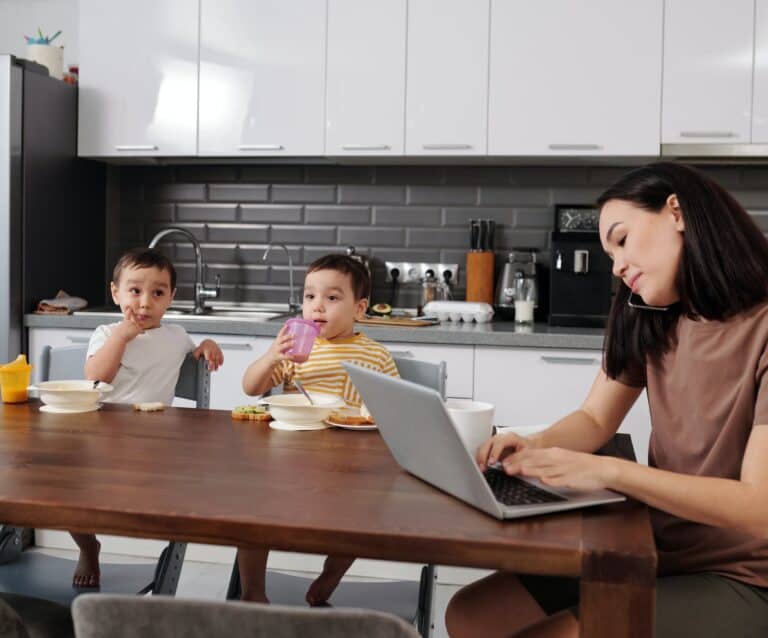 busy woman in the kitchen with children