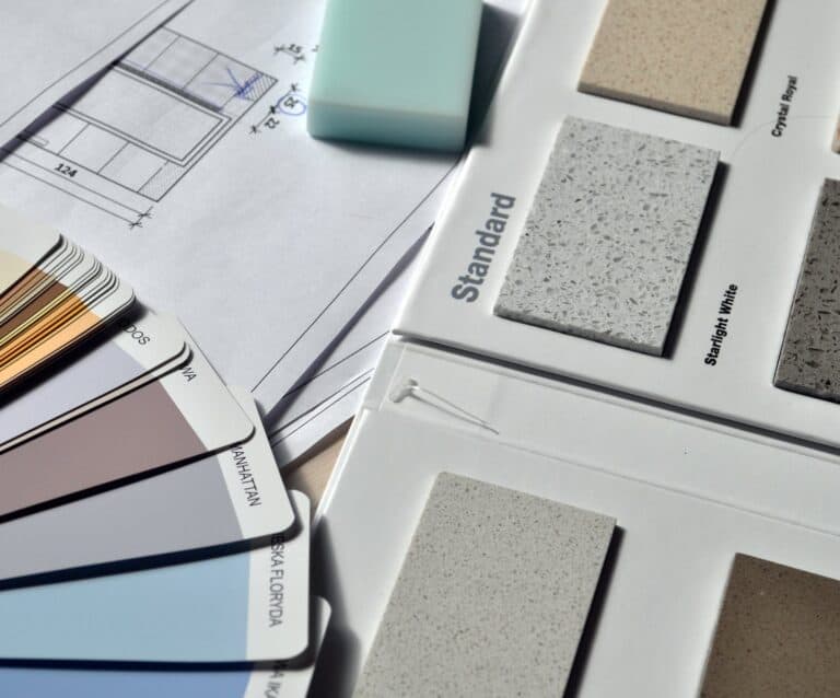 gray standard color book near green eraser