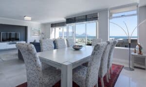 rectangular white wooden table with chairs