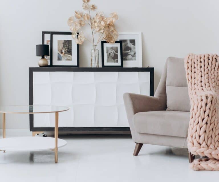 beige sofa chair near a table